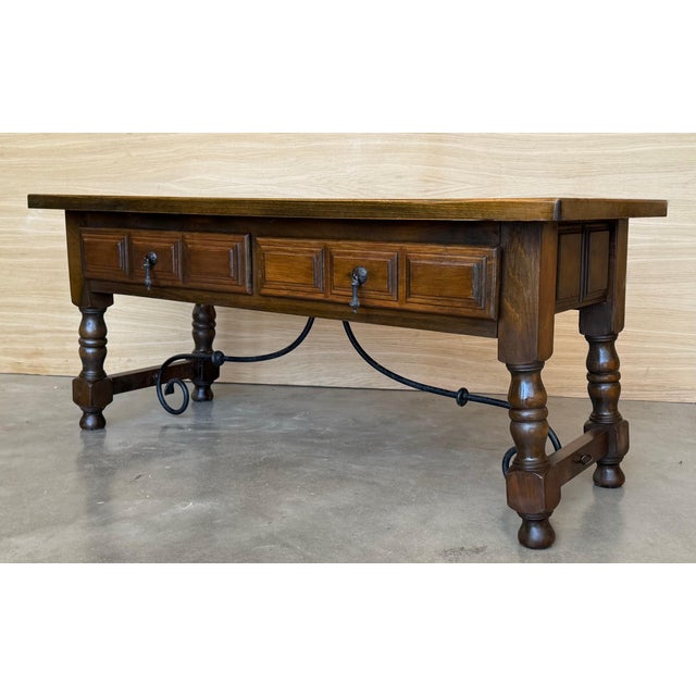 Spanish rectangular coffee table with turned Legs and iron stretcher. This tables has two working drawers in each side,...