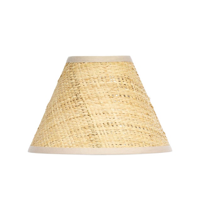 Crafted from warm Rattan, the Polly Alternate Shade features a gently tapered form that adds quiet movement and texture....
