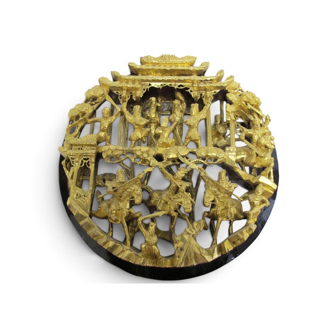 Chinese carved wood wall medallion showing an elaborate 3D battle scene. Carved from a single piece of wood, meticulously...
