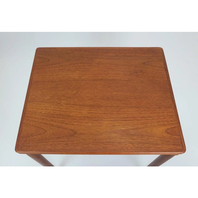 Set of 3 nesting tables. Made in the early 1960s. No label. Origin probably Denmark. Teak veneer with beautiful grand and...