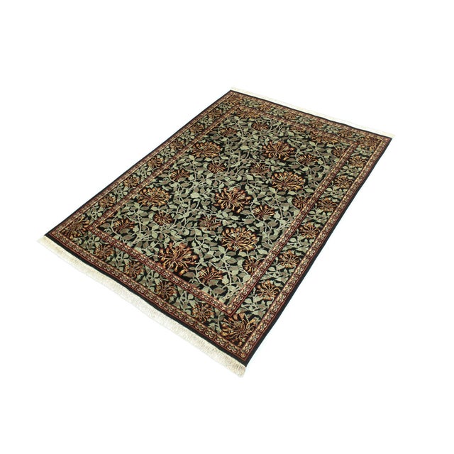 Designed with mesmerizing intricacy and gorgeous color palette, this hand-knotted masterpiece demonstrates the beauty and...