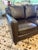 Handsome Bradington Young three‑cushion sofa, upholstered in a rich chocolate brown premium leather that reads warm,...