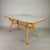 Elegant 1950s-style dining table in the Ico Parisi style. Beech wood frame, light gray stained glass top. Restored to its...
