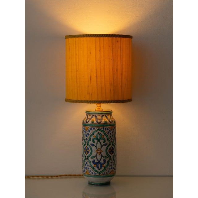 This is a Spanish ceramic table lamp hand-painted by the Cerámica Al Yarrar workshop in Granada, decorated in the Moorish...