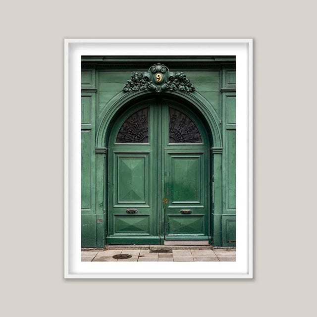 Historic European architecture often reveals its character at street level through tall, double doors - sometimes ornate,...