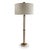 Natural unpolished stone marble turnings are accented with aged brass finished metal hardware for this Trivoli lamp. The...