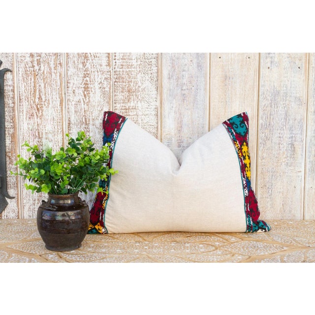 This linen pillow is flanked by rare antique tribal borders, it is bordered by hand-woven, ply-split camel girth lace and...