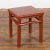 A Chinese late Qing Dynasty period side table or stool from the early 20th century, with red lacquer, humpback stretchers...
