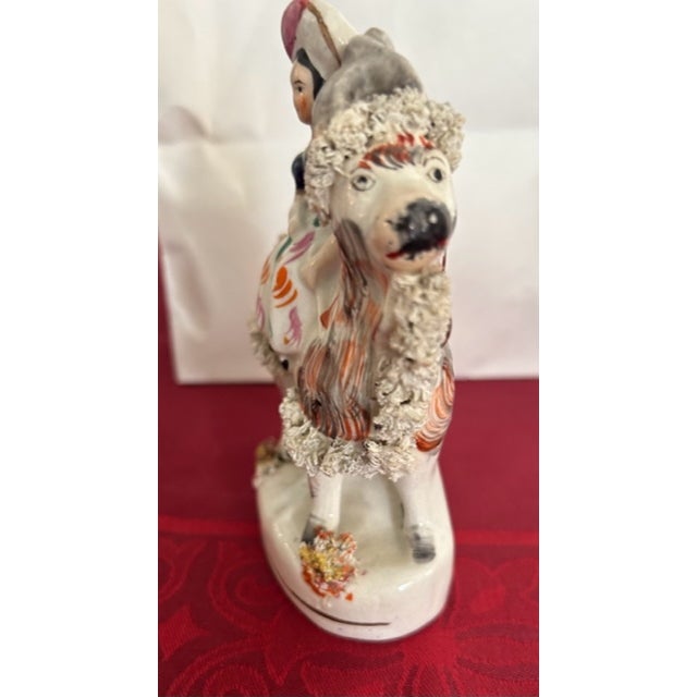 Pair of 2 Antique Staffordshire Figurines of Girls on Goats. Circa 1830 H: 5" W: 3" D: 2" Not reproductions. Hole on...