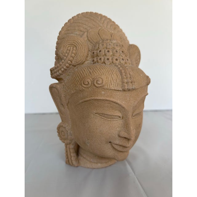 Sandstone goddess, hand carved head sculpture. Depicts human and divine Hindu deity, embodies beauty and cosmic,...