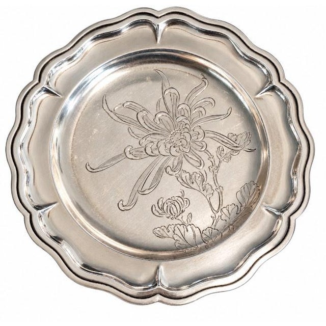 Two Japanese candy dishes, 7" in diameter. From the Meiji period (1868 - 1912) Hand chased floral pattern interiors....