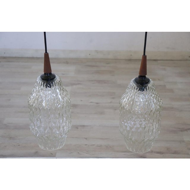 This pair of 1960s Italian ceiling lamps, while not having any brands or signatures, boasts quality in materials and...