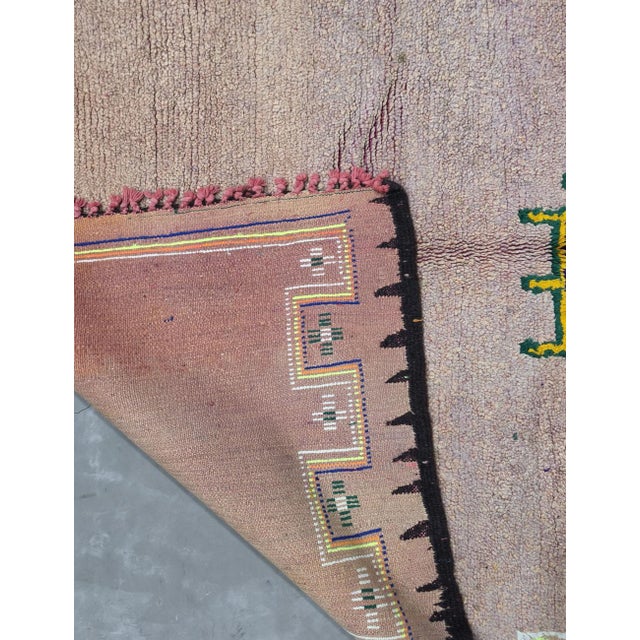 Vintage Beige Moroccan Rug – Handmade Tribal Berber Wool Rug This beautiful handmade Moroccan rug features a soft faded...