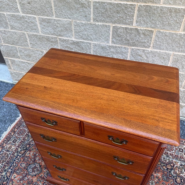 A vintage Kling Furniture Chippendale mahogany highboy dresser having two small drawers over four large drawers and...
