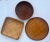 A set of three winnowing trays that would live their best life as a wall display. All are in varying shades of tan and...