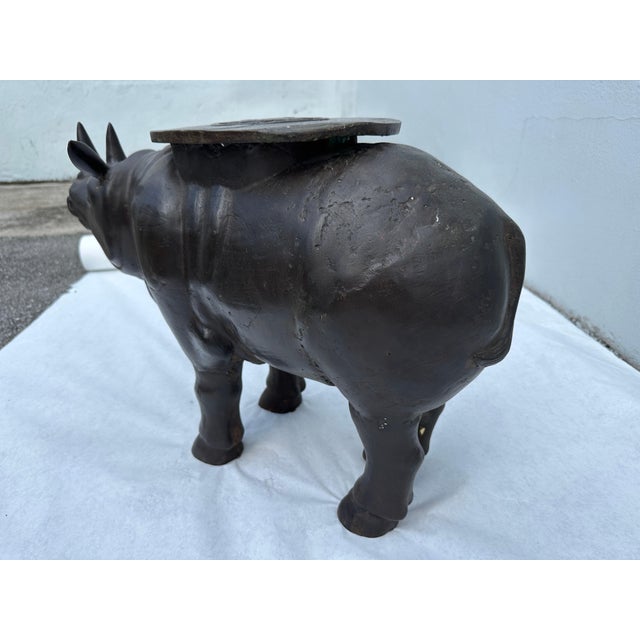 Fantastic vintage bronze statue of a patinated Rhino with Sun medallion to top. A beautiful rendition of a handsome rhino....