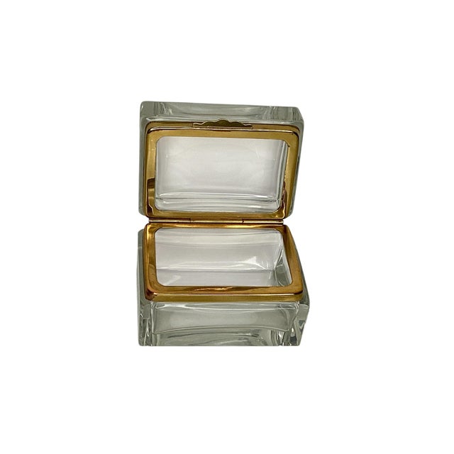 A clear Murano glass box with gilt metal fitting. In very good vintage condition. A great addition to a book shelf or a...