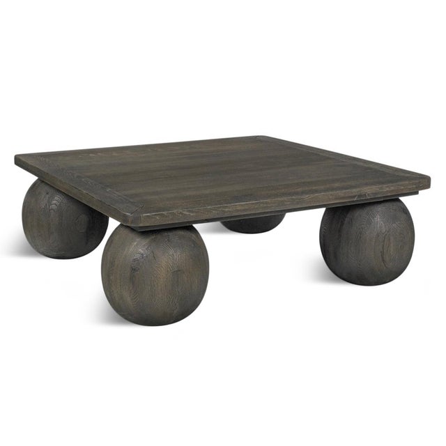 Modern square coffee table crafted from oak and mango wood with a rich graphite gray-brown finish. The thick square top...