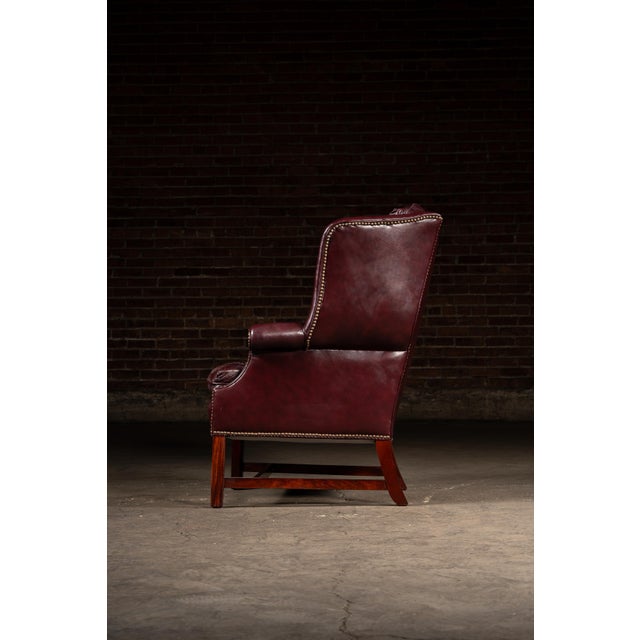 Oxblood Red Mid 20th Century Tufted Leather Wingback Chesterfield Armchair With Ottoman in Oxblood For Sale - Image 8 of 15