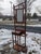 A commanding late 19th-century Victorian hall tree by Hoffmeir Furniture, distinguished by its architectural presence,...