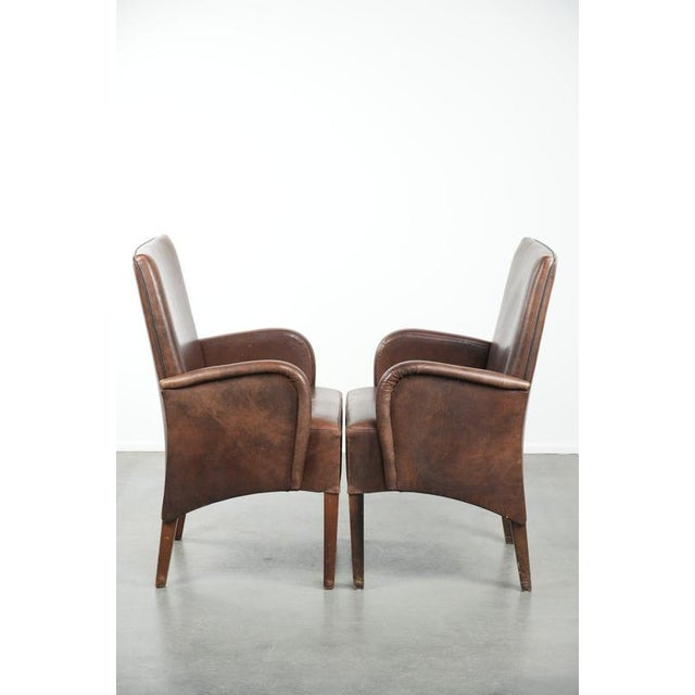 We are offering this set of 2 beautifully finished dining chairs/side chairs with armrests made of cowhide leather. This...