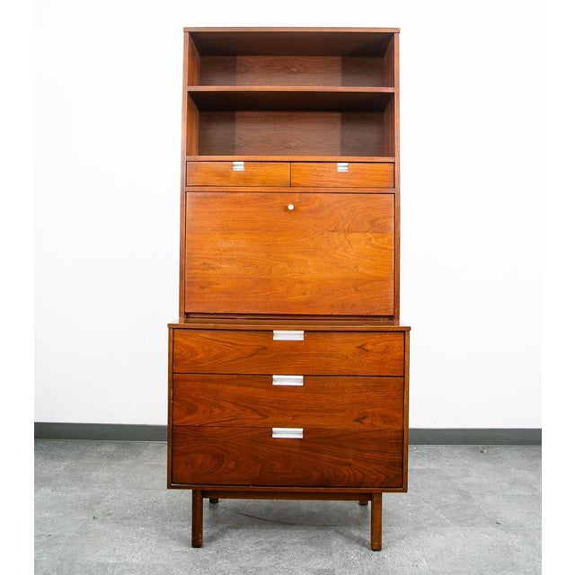 Mid century modern chest / cabinet with drop down. Comes with 2 sections, bottom storage section offers 3 drawers while...