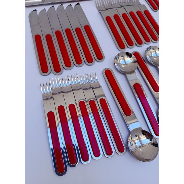 Extraordinary 32-piece cutlery set designed by Sergio Asti Lauffer Boca for ICM 18/10 stainless steel with red melamine...