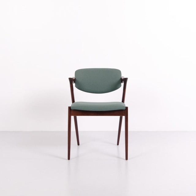 Set of dining chairs, model 42, designed by kai kristiansen in the 1960s. The chairs are crafted in rosewood and are...