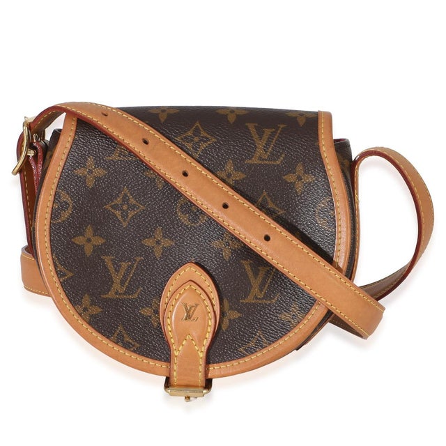 Item #: 154409 Features Interior: One slip pocket Dimensions: 6.5 x 6.5 x 3 in Handbag Closure Type: Buckle Strap Length:...