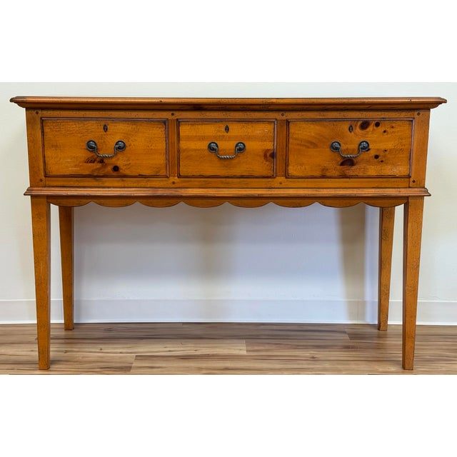 Vintage Drexel Heritage knotty pine console or sofa table from the Pinehurst collection. Features three drawers with...