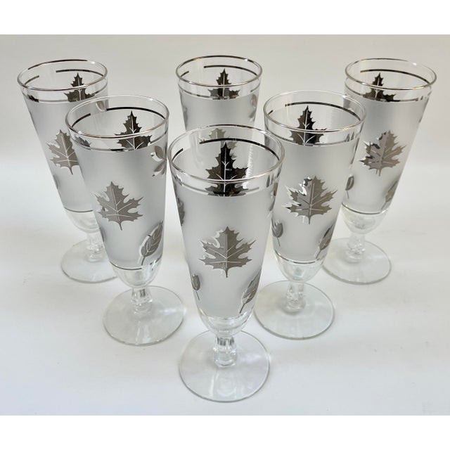 Set of seven Libbey Plisner tall drinking glasses. These glasses were used as pilsner but can be used for various...