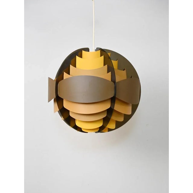 Original vintage Scandinavian lamp consisting of thin plastic bands. This modern antique piece traces in style and colors...