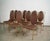 Set of eight vintage Italian dining chairs for sale. These were manufactured in Italy in the 1970's, and have a brass...