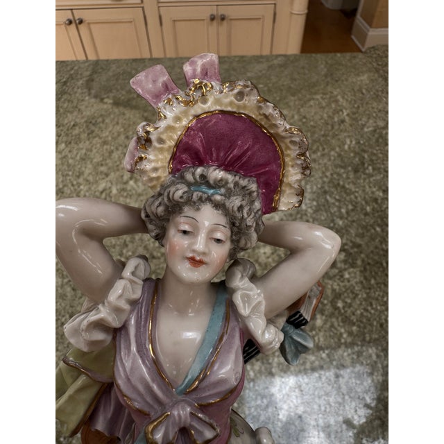 A pair of beautiful musician porcelain figurines