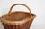 This vintage woven basket features a natural design with a braided handle. The warm, earthy tones add rustic charm to your...