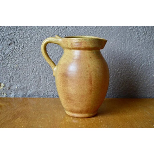 This small broc or sandstone pitcher is touching simplicity. We love its form, rustic and essential highlighted by a...