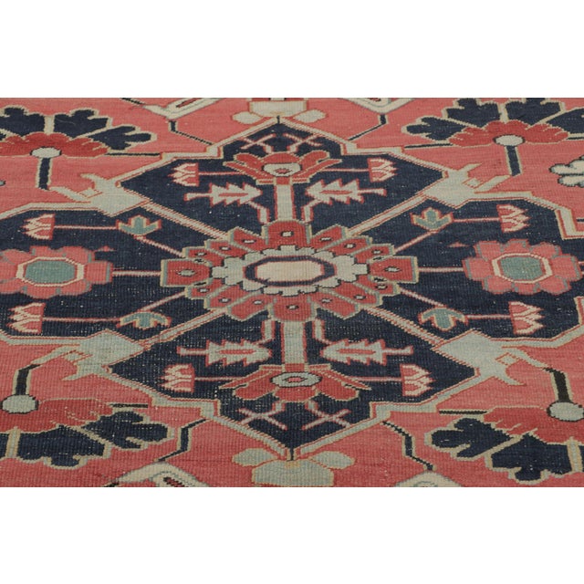 Hand-knotted in wool circa 1880, this 9x12 antique Persian rug is a distinguished example of the revered Serapi tradition,...