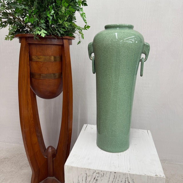 "About This Piece About This Piece This tall green celadon vase brings together elegance, tradition, and organic artistry....