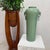 "About This Piece About This Piece This tall green celadon vase brings together elegance, tradition, and organic artistry....