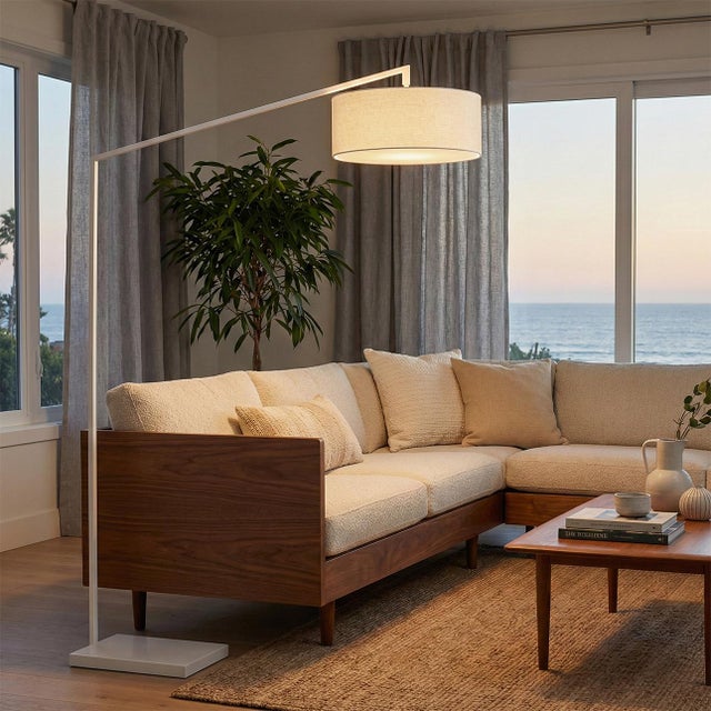 The Stretch Arc Floor Lamp is a modern lighting solution designed by Kirby Groce in 2011. This lamp features a striking...