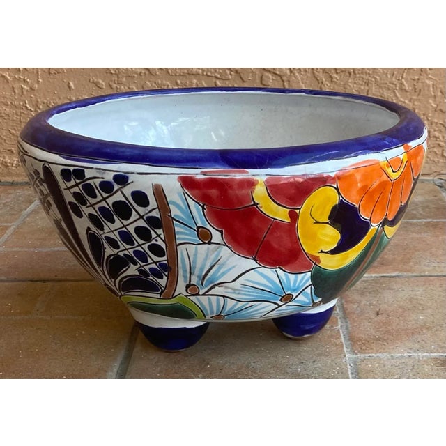 We bought our planter either in Mexico or on the border .... and especially love the feet. Looks like the beautiful,...