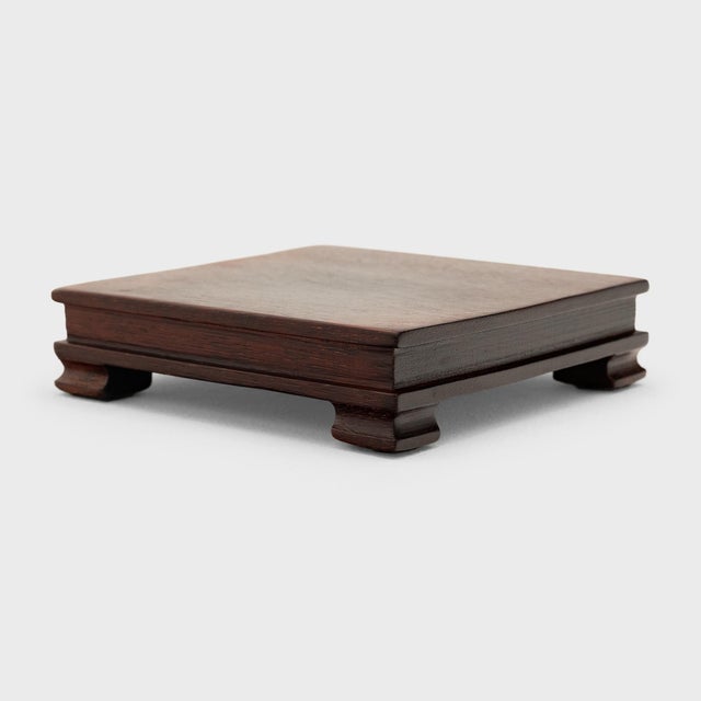 Simple yet refined, this petite wooden riser is a sophisticated way to elevate a work of art or add dimension to a...
