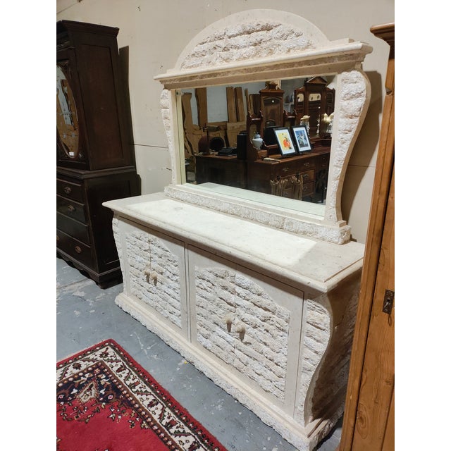 This striking French Provincial credenza with mirror dates to the mid-20th century (circa 1950–1970) and is crafted in...