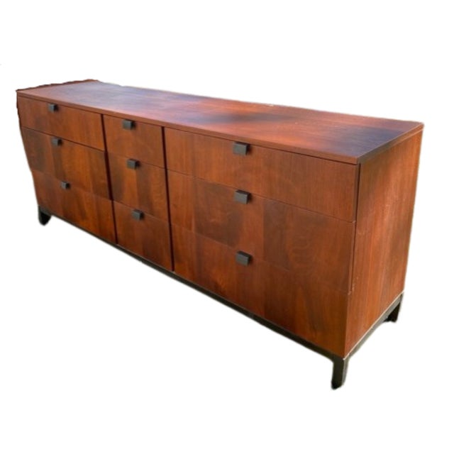 Mid century modern Swedish credenza/sideboard (c1960). in rosewood with nine drawers on short tapered black legs and base....