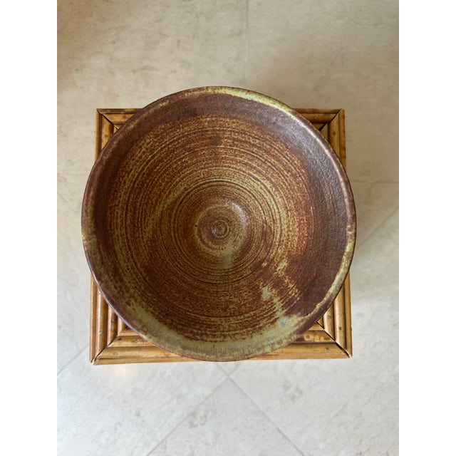 Fabulous Signed Brown Terracotta Bowl dating to the 1970’s. Brown terracotta base with Bronze, Brown, Ochre and Pale Green...