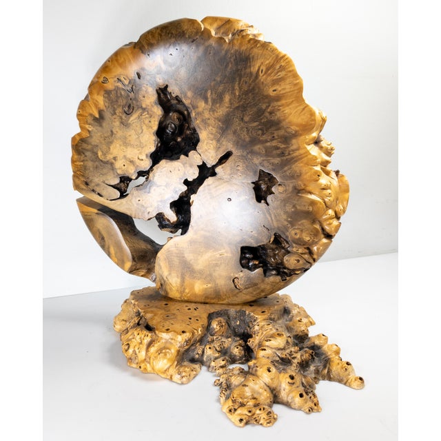 We are selling this pretty Contemporary carved wood vase sculpture. The vase is carved with a large vertical circle and...