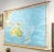 This large wall map was printed in Germany in 1961 and is mounted on linen on a simple wooden dowel frame with leather...