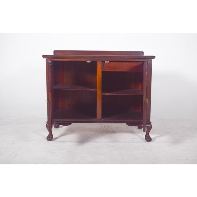 Two-door sideboard with a slight elevation. with a compact structure and balanced proportions, the doors are decorated...