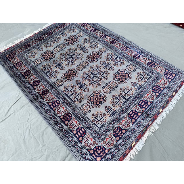 A fine hand-knotted Turkmen Khal Mohammadi rug in a rare dove-grey colorway — an uncommon departure from the signature...