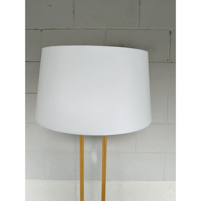 Modern stylish Currey & Co. Glossary Floor Lamp / Gold. Black base with gold accents. Looped brass body. Original retail...